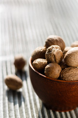 aromatic nutmeg on a gray wooden background