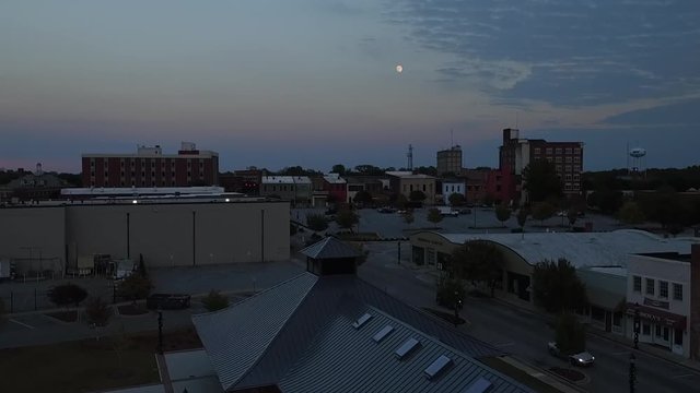 Aerial footage of uptown Greenwood SC during full Moon.