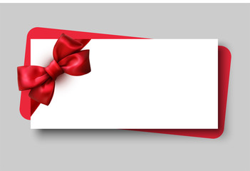 White gift card with red beautiful satin bow.