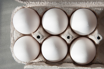 chicken eggs in a cardboard tray