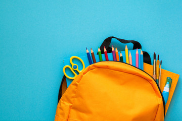 Back to school concept. Backpack with school supplies. Top view. Copy space - Powered by Adobe