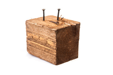 Big old dark cube is cut out from old wood. Isolated on white