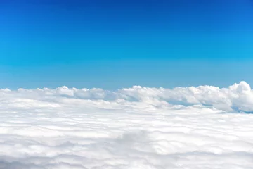Fotobehang White clouds on the blue sky as nature background © Pavlo Vakhrushev
