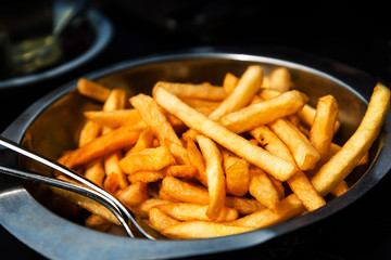 Golden French fries potatoes ready to be eaten