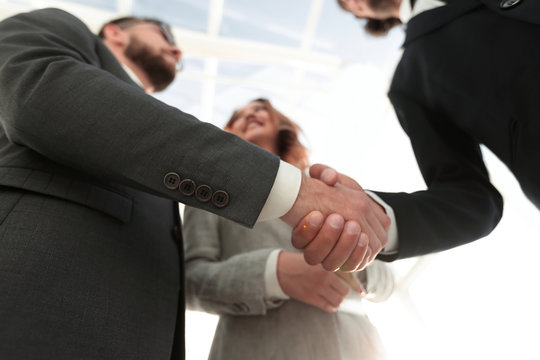 Photo of handshake of two happy businessmen