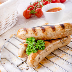 delicious bratwurst with ketchup and fresh rolls