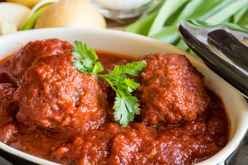 Juicy Meatballs with Tomato Sauce and Ingredients for Cooking