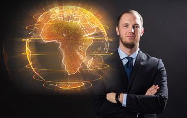 business, globalization and future technology concept - close up of businessman with earth hologram...