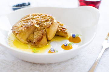 Fried Goose Liver with Apple Sauce on White Plate. Foie Gras Fine Food.