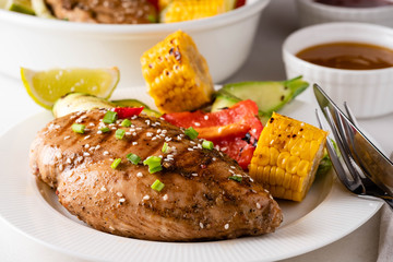 Chicken fillet with corn, pepper and zucchini.