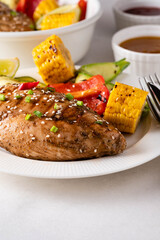 Chicken fillet with corn, pepper and zucchini.