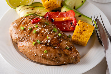 Chicken fillet with corn, pepper and zucchini.