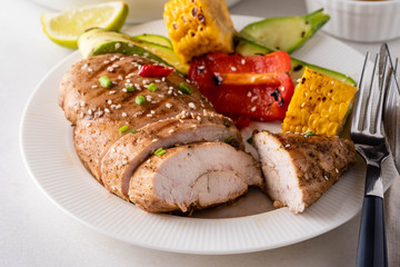 Chicken fillet with corn, pepper and zucchini.