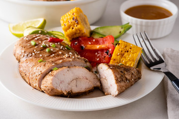 Chicken fillet with corn, pepper and zucchini.