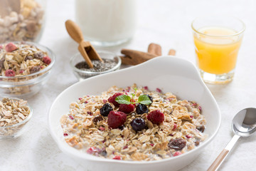 Muesli With Milk, Chia Seeds, Berries and Cinnamon with Freshly Squeezed Orange Juice