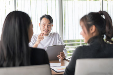 Smiling businessman during job interview.Job interview concept. Businessman explaining and listen to candidate answers.