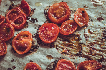 Fototapeta na wymiar Roasted Cherry Tomatoes with Salt, Black Sesame and Olive Oil. Rustic Style.