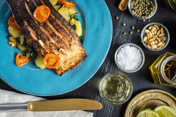 Grilled Salmon with Vegetables Served on Blue Plate. Healthy Meal.