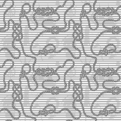 Naklejka premium Seamless rope with sea knots against the background of strips