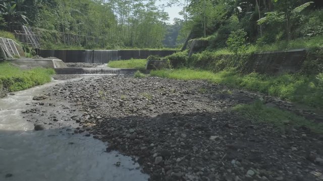 View of small river in backward footage, Ledok Sambi village, Yogyakarta, Indonesia. April 2018