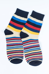 A pair of striped socks. Stripes color: mustard, red, black, blue and white . 