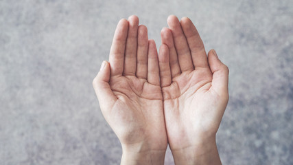 Woman cupped hands holding something