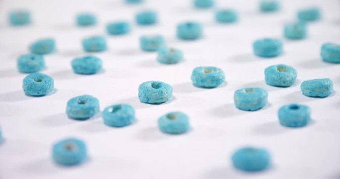 Froot loops arranged on white background 