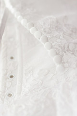 Obraz premium White wedding dress. Laces and buttons.