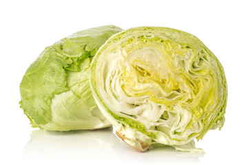 Iceberg lettuce one fresh green cabbage head and section half isolated on white background.