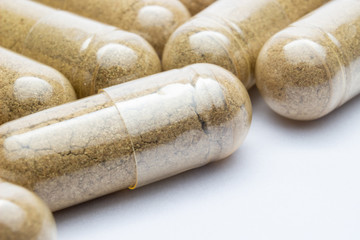 Herbal Drug. Close up Herbal medicine in clear capsule.