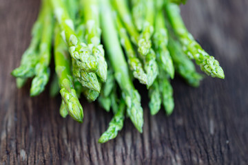 Asparagus. Raw asparagus. Fresh Asparagus.Green Asparagus on wooden background