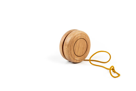 A wooden yo-yo on white background.