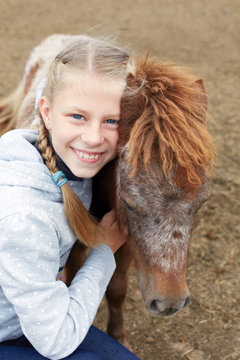 Pony and horsewoman - little girl and her best friend
