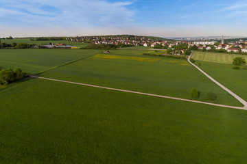 Fototapeta premium Luftbild mit Blick über die Wiesen nach Korntal in Baden Württemberg