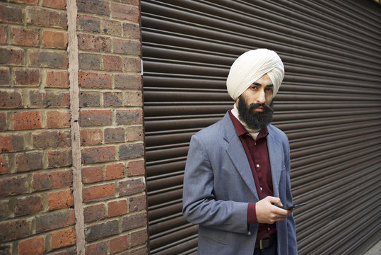 Portrait of a Sikh businessman in a city street