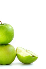 one green Apple on another and next half bitten Apple on white background