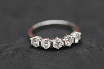 Diamond ring on black background