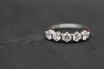 Diamond ring on black background
