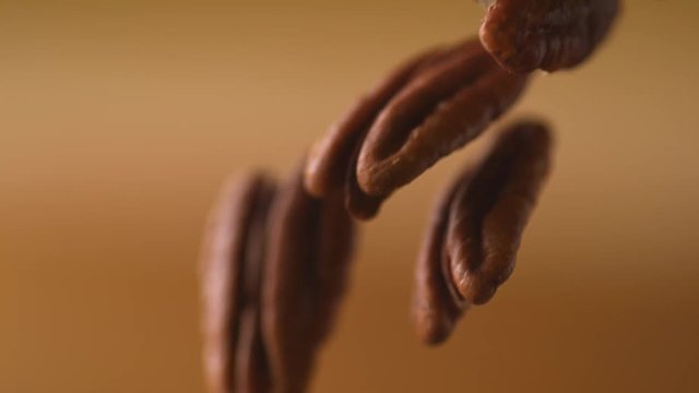 Pecan nuts falling. Shot with high speed camera, phantom flex 4K. Slow Motion.