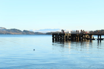 Fototapeta premium Calm water river with mountains