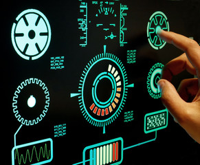 close up of hand pushing botton on futuristic user interface concept. Head up Display(HUD)