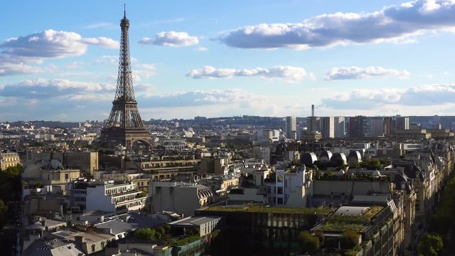 famous Eiffel Tower and Paris roofs at sunny day, Paris France