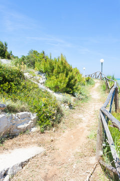 Lido Cala Lunga, Apulia - Hiking trail at the coastline of the Mediterranean Sea