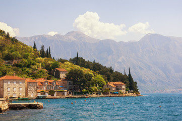 Sunny Mediterranean landscape. Montenegro, view of Bay of Kotor and ancient town of Perast