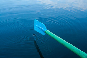 Blue paddle in water