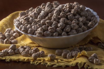 Uncooked dry chickpeas on bowl