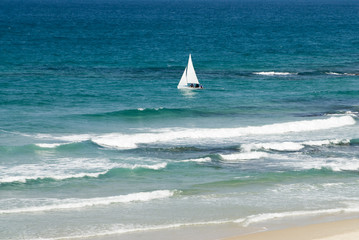 Single small sailboat in the sea