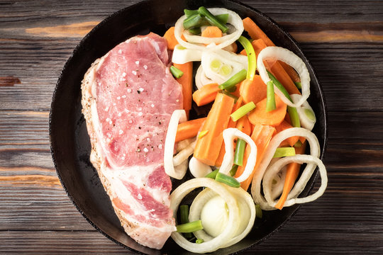 Raw pork chop marinated meat roll with assorted vegetables