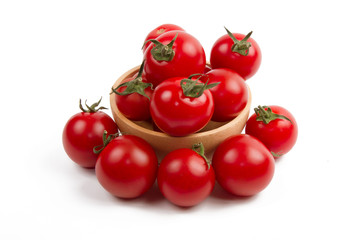 Fresh tomato in wood bowl isolated white background, Healthy skin with eating tomatoes everyday....