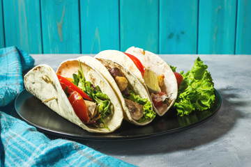 Fresh delicious mexican tacos on concrete rustic background